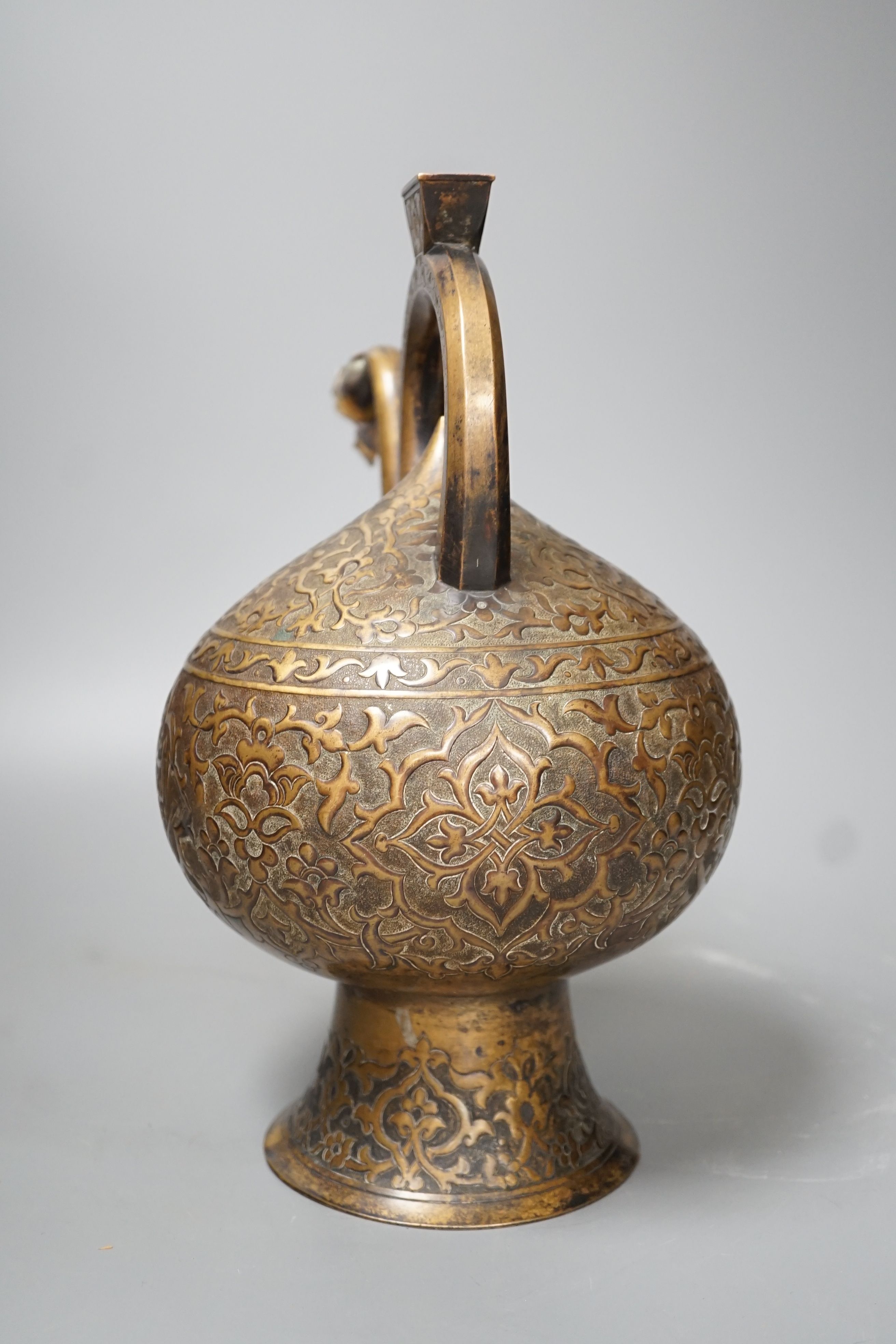 A 19th century Turkish bronze boza ewer - 30cm high